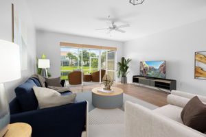 Living Room with lake view - Virtually Staged