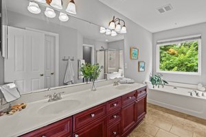 Bright and airy primary bath w/large walk-in closet.