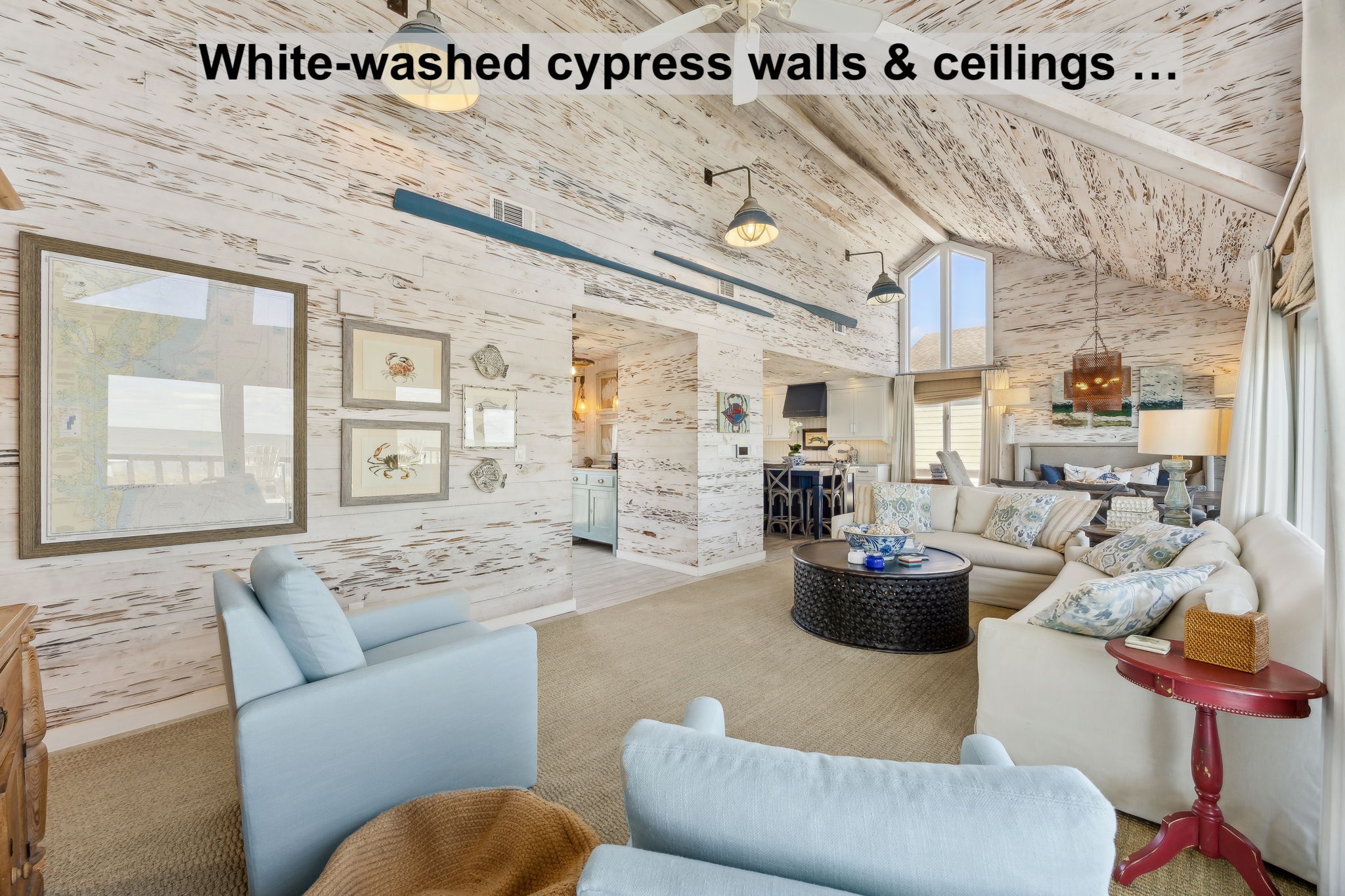 ...with automated woven blinds, vaulted cypress detail, and an easy flow from living to dining and kitchen.