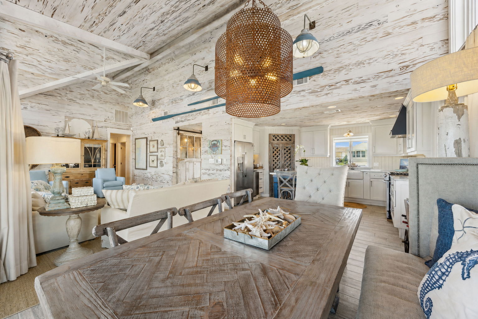 From dining to living, the craftsmanship carries through in every texture, finish, and thoughtful coastal detail...