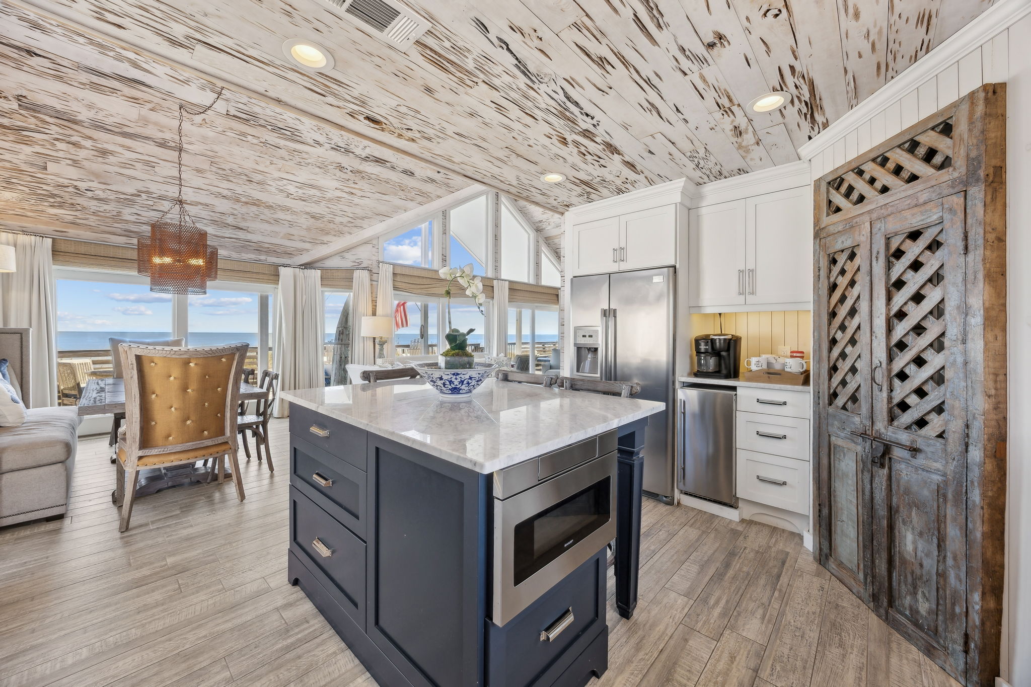 ...with open sightlines that keep the ocean, dining area, and great room beautifully connected.