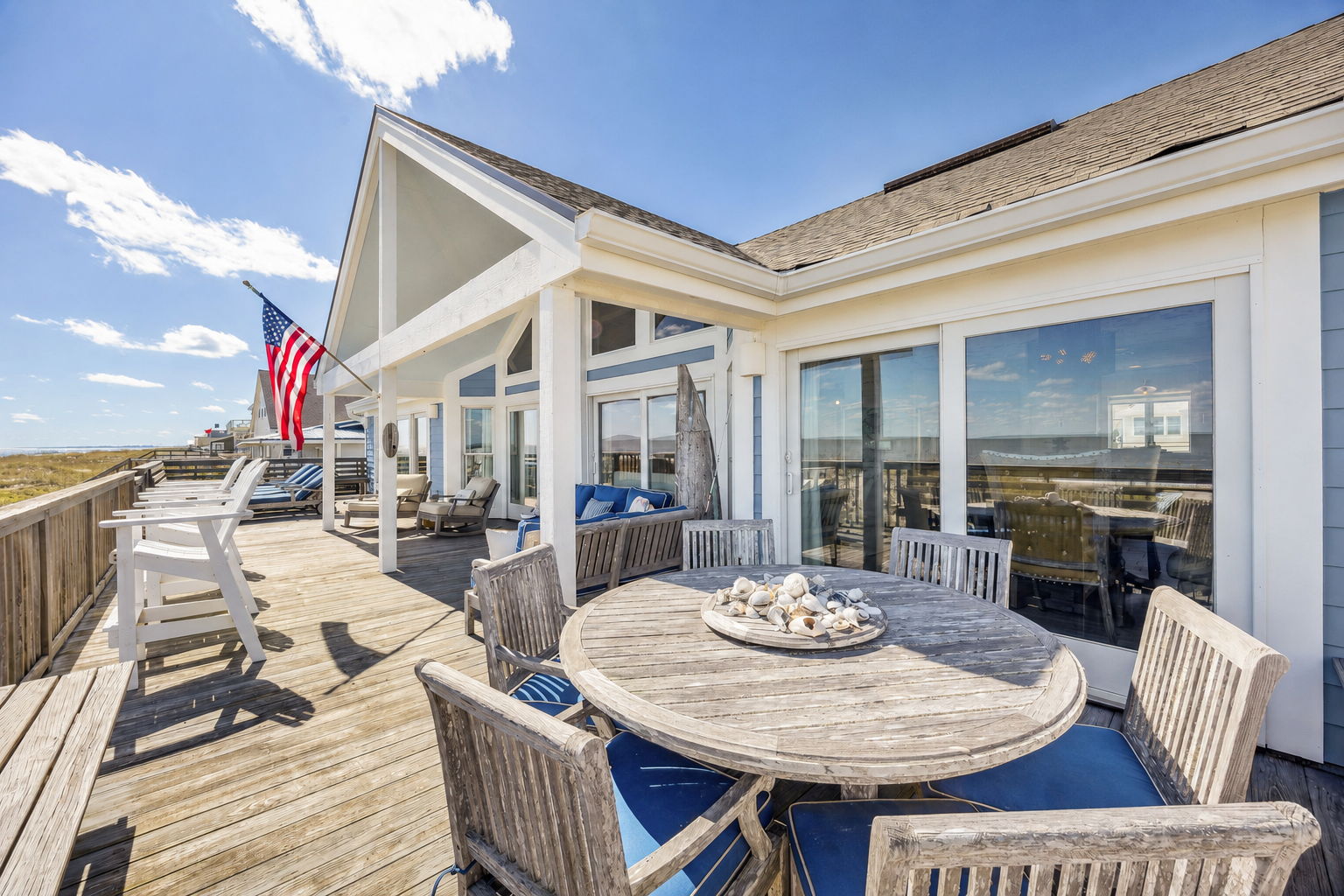 ..with space to dine, gather, and take in the full oceanfront setting.