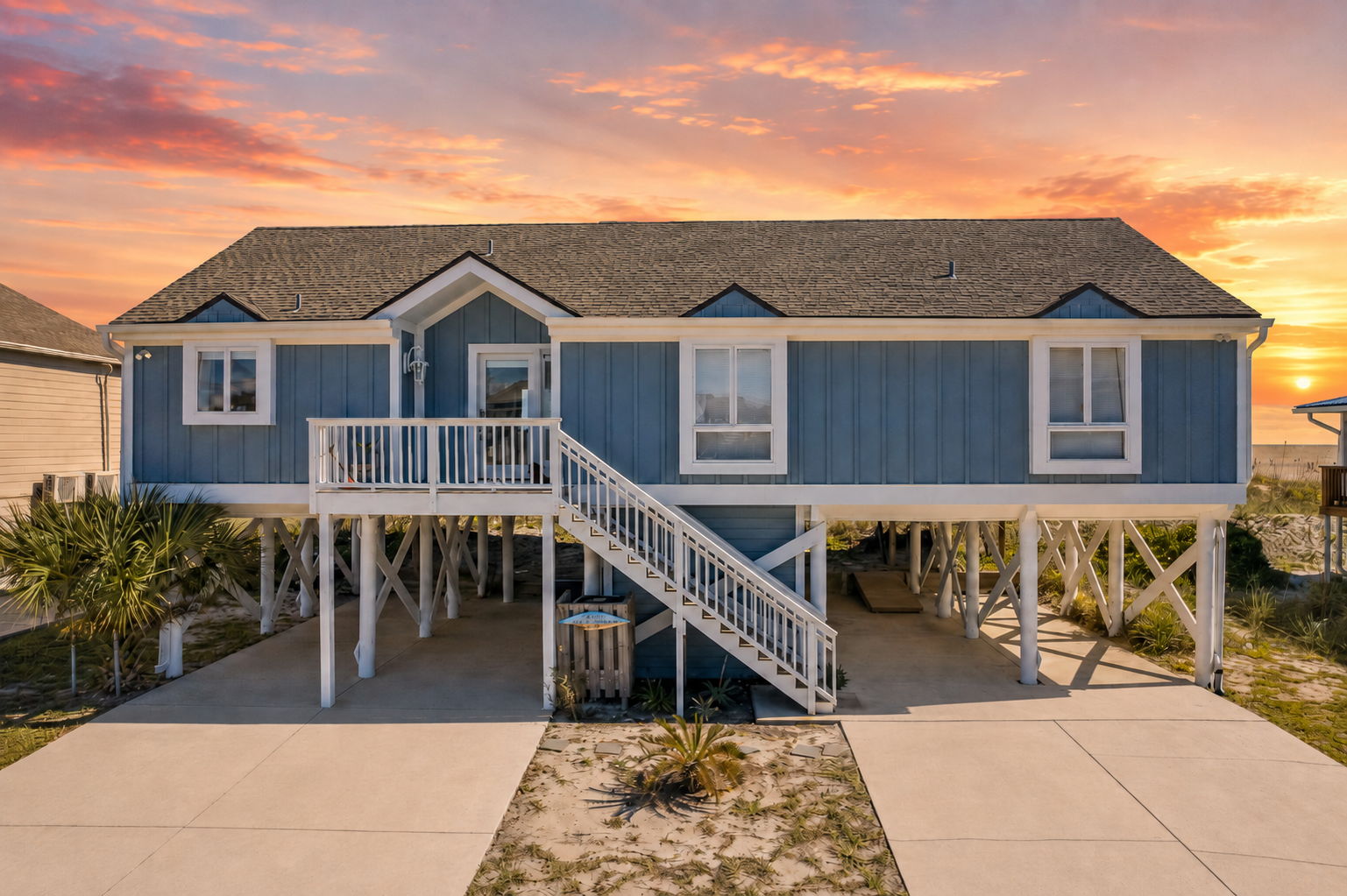 And at day’s end, you return to this — an oceanfront home with sunrise skies, salty air, and the beach as your backyard.