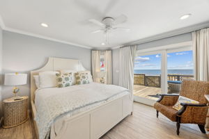 The primary suite brings the ocean even closer, with soft coastal layers and direct deck access...