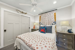 A second guest bedroom carries the coastal personality forward with bold nautical accents...