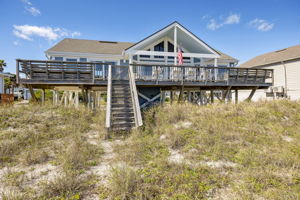 The home sits right at the edge of the dunes...