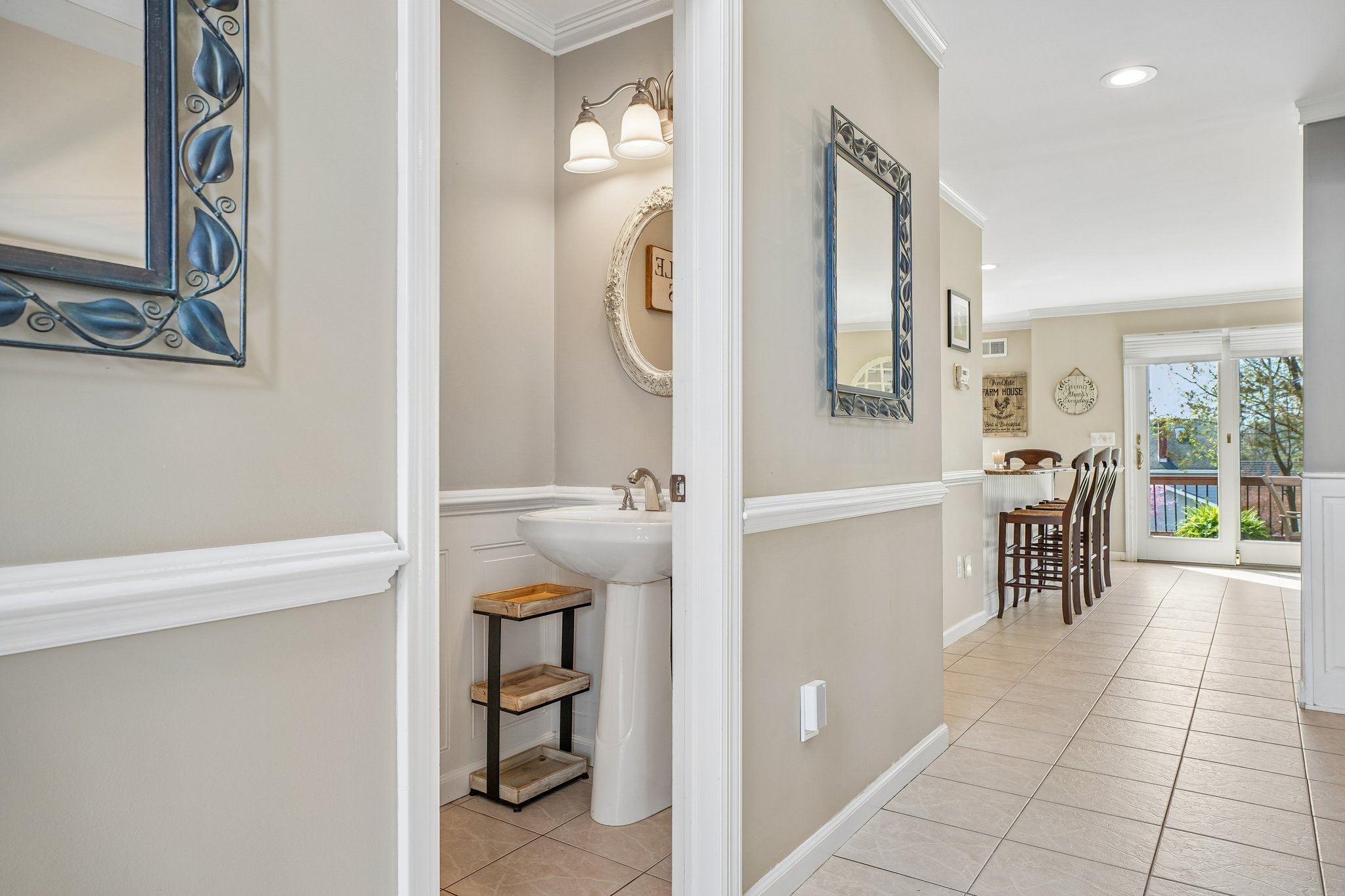 Powder room thoughtfully placed for convenience - because the little details matter in how a home lives.