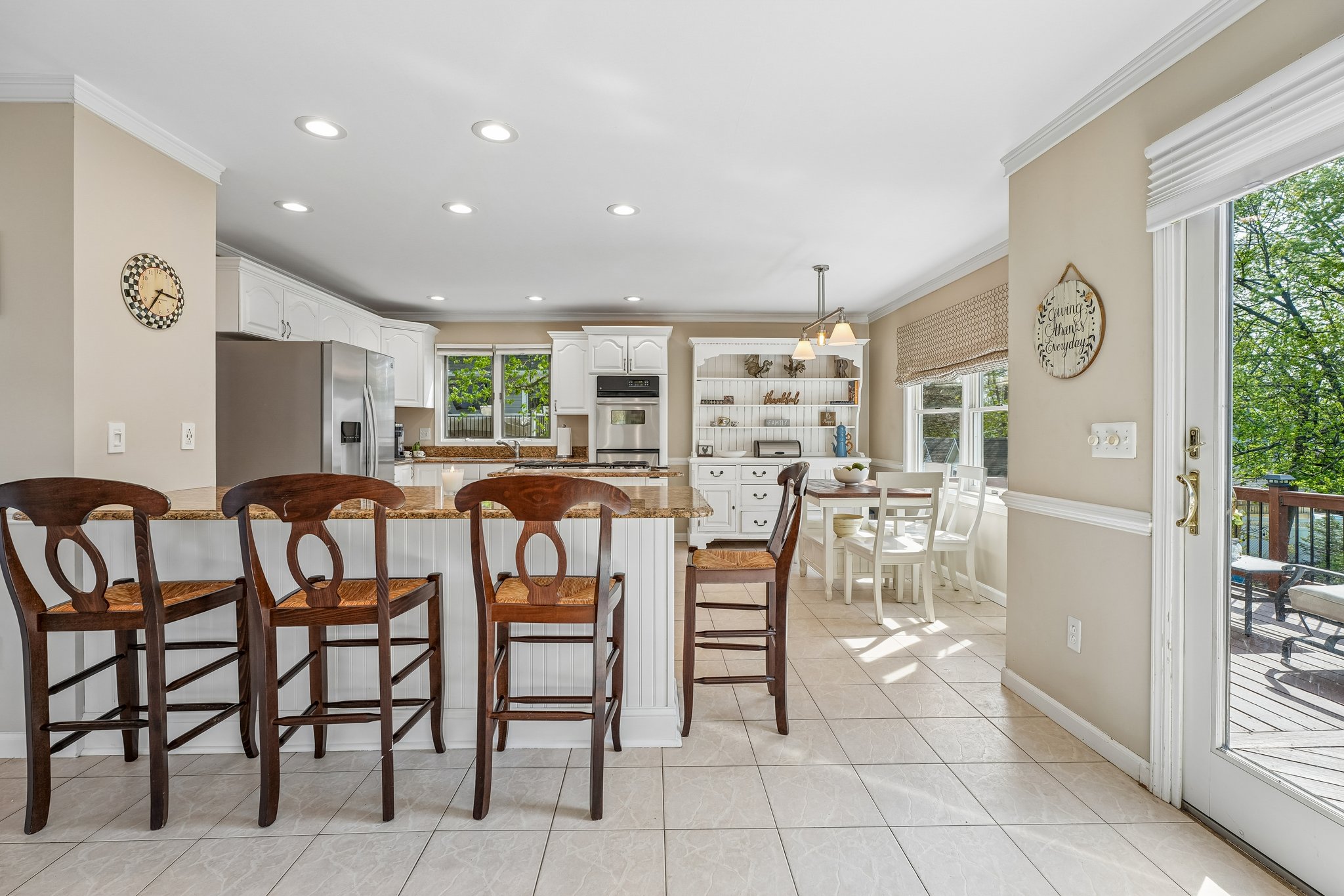 Pull up a chair - this is where homework happens, conversations start, and guests naturally gather.