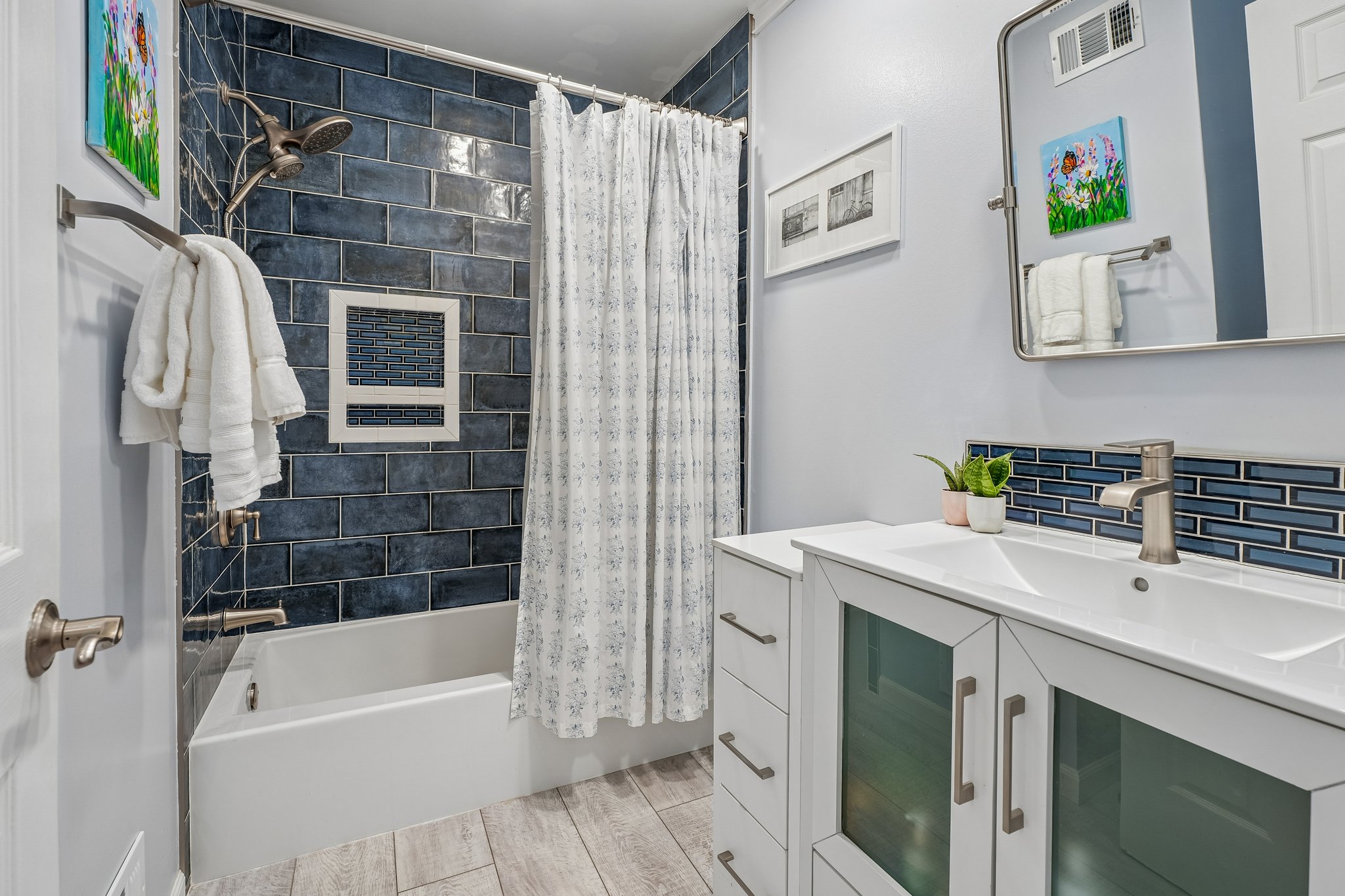 A stylish 2nd floor hall bath with rich tile and clean finishes - ready for busy mornings and easy evenings alike.