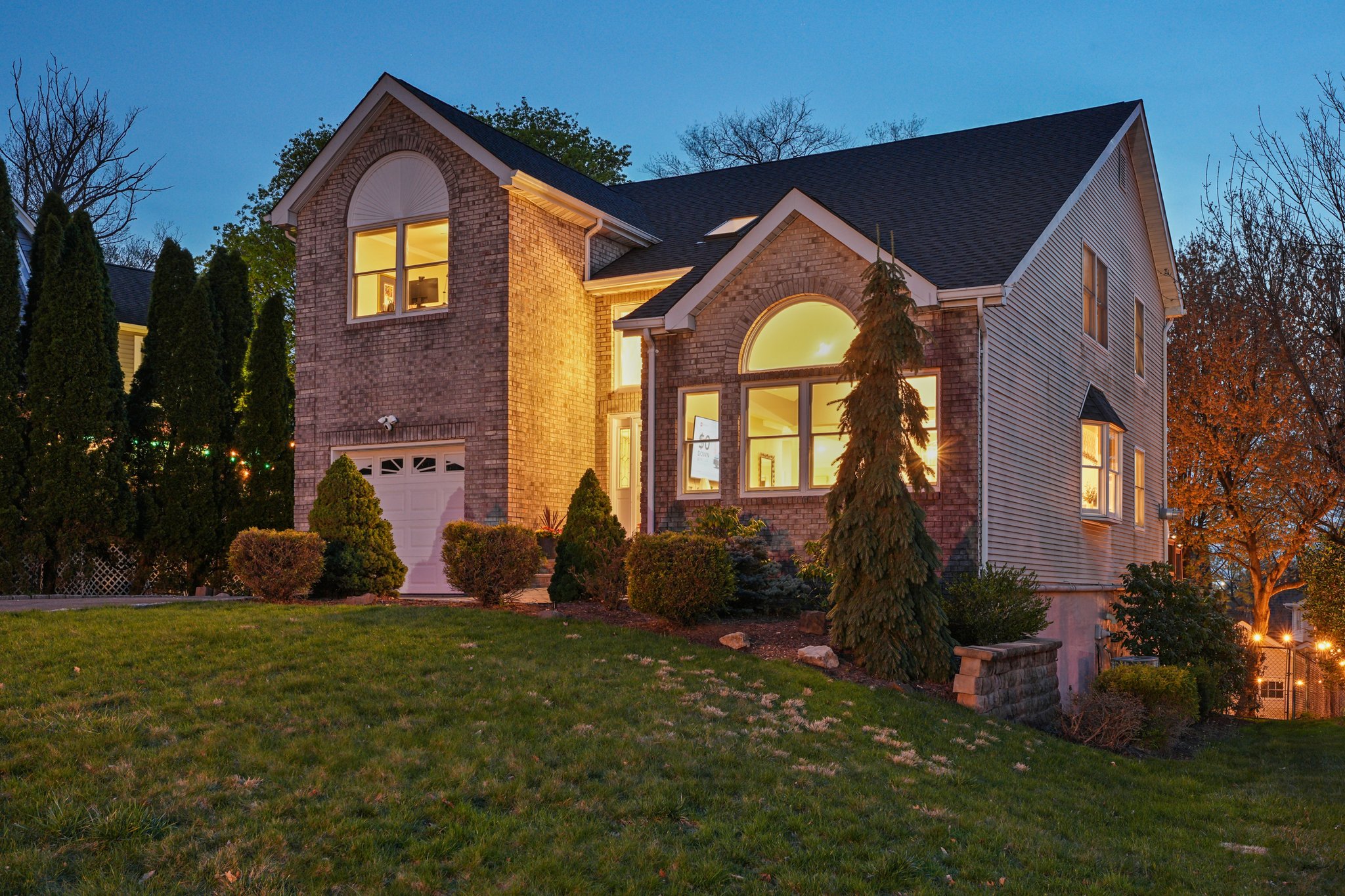As the sun sets, the home begins to glow - warm, inviting, and effortlessly appealing.