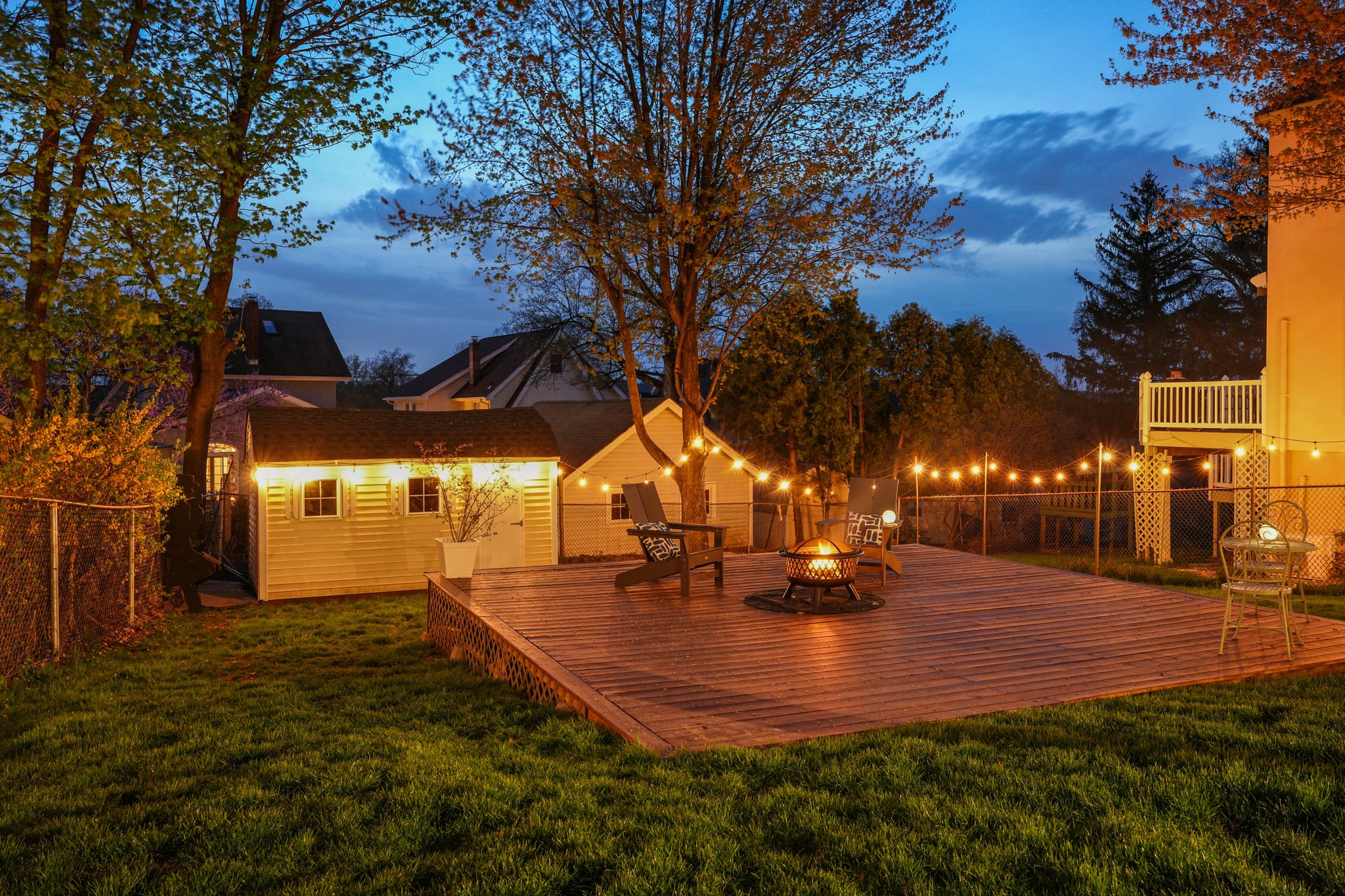 From every angle, the home glows - a place that feels just as inviting after dark as it does in the daylight.