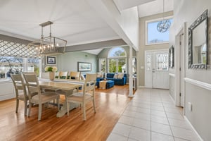Living dining area - a welcoming heart of this gem - open, airy, and filled with natural light from every angle.