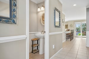 Powder room thoughtfully placed for convenience - because the little details matter in how a home lives.
