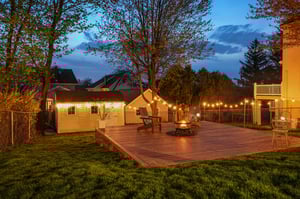 From every angle, the home glows - a place that feels just as inviting after dark as it does in the daylight.