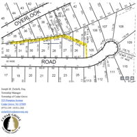 Sewer easement on south side of driveway until it turns left.  See small "78" in street