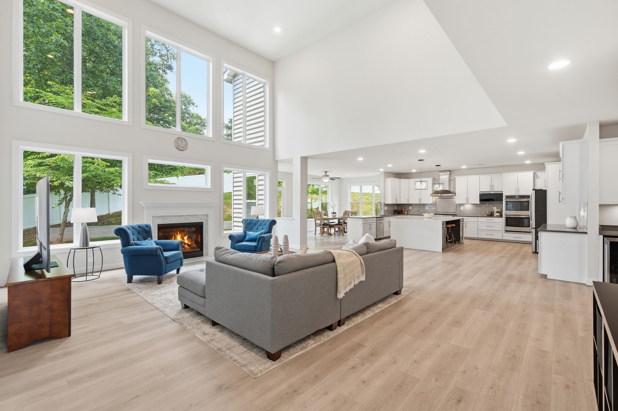 Two Story Family Room Open to Kitchen and Breakfast Room