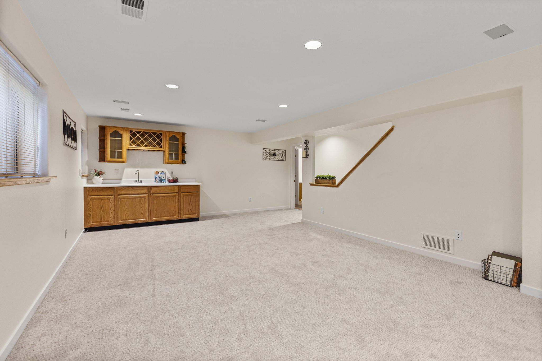 Fully finished basement with bar and sink