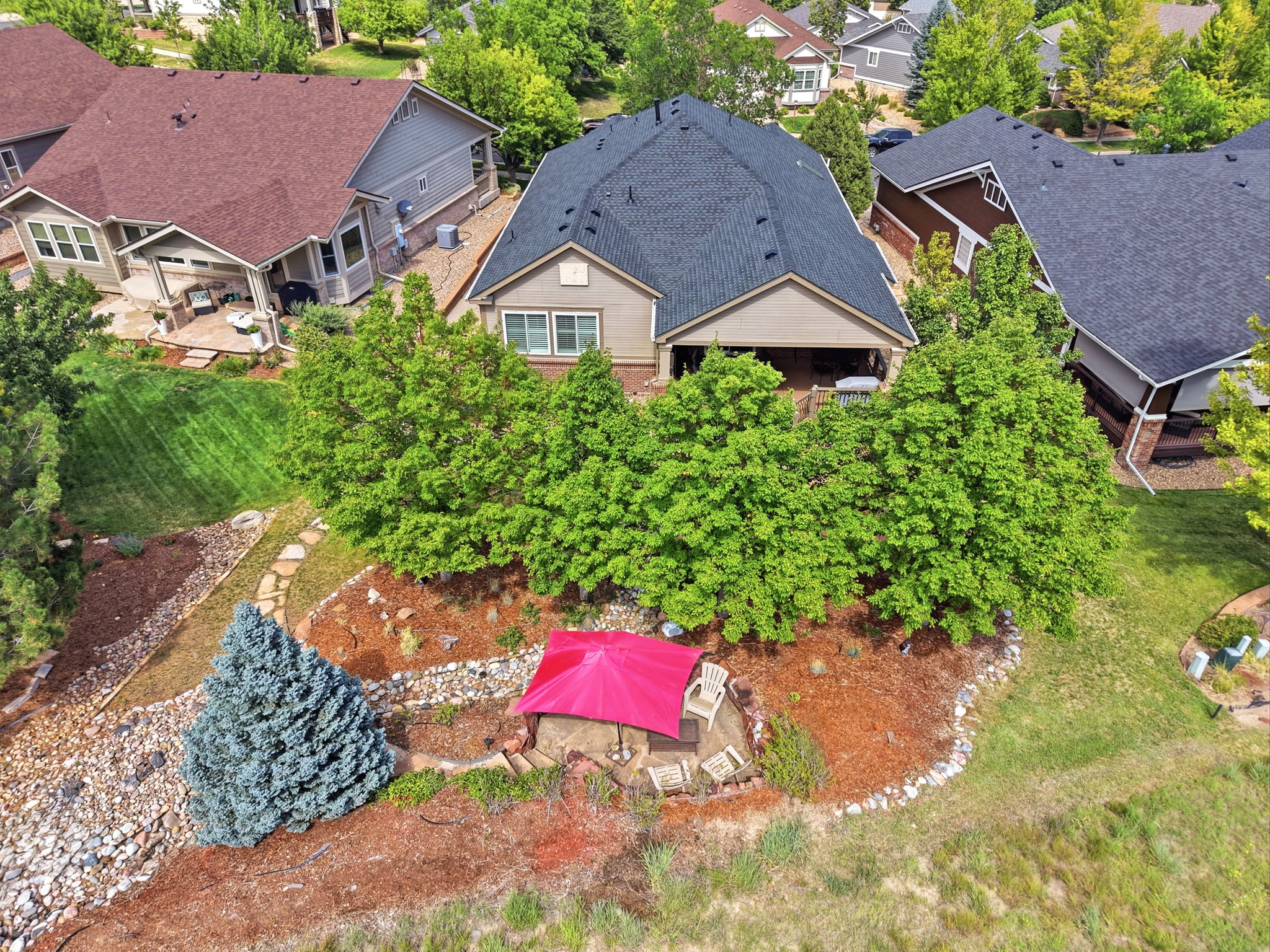 VIEW OF FIRE PIT AND BACK YARD