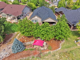 VIEW OF FIRE PIT AND BACK YARD