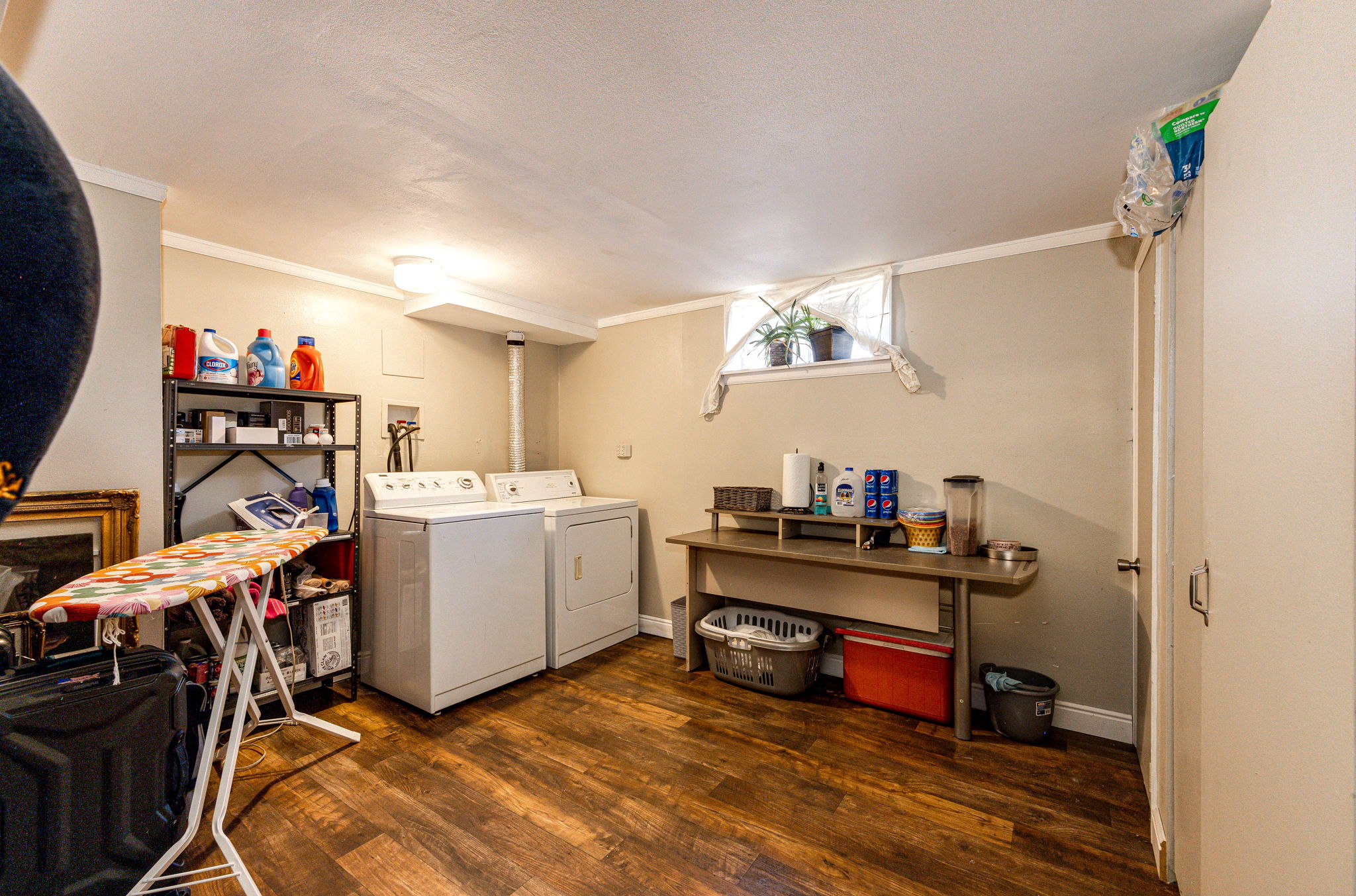 Laundry room area with additional storage