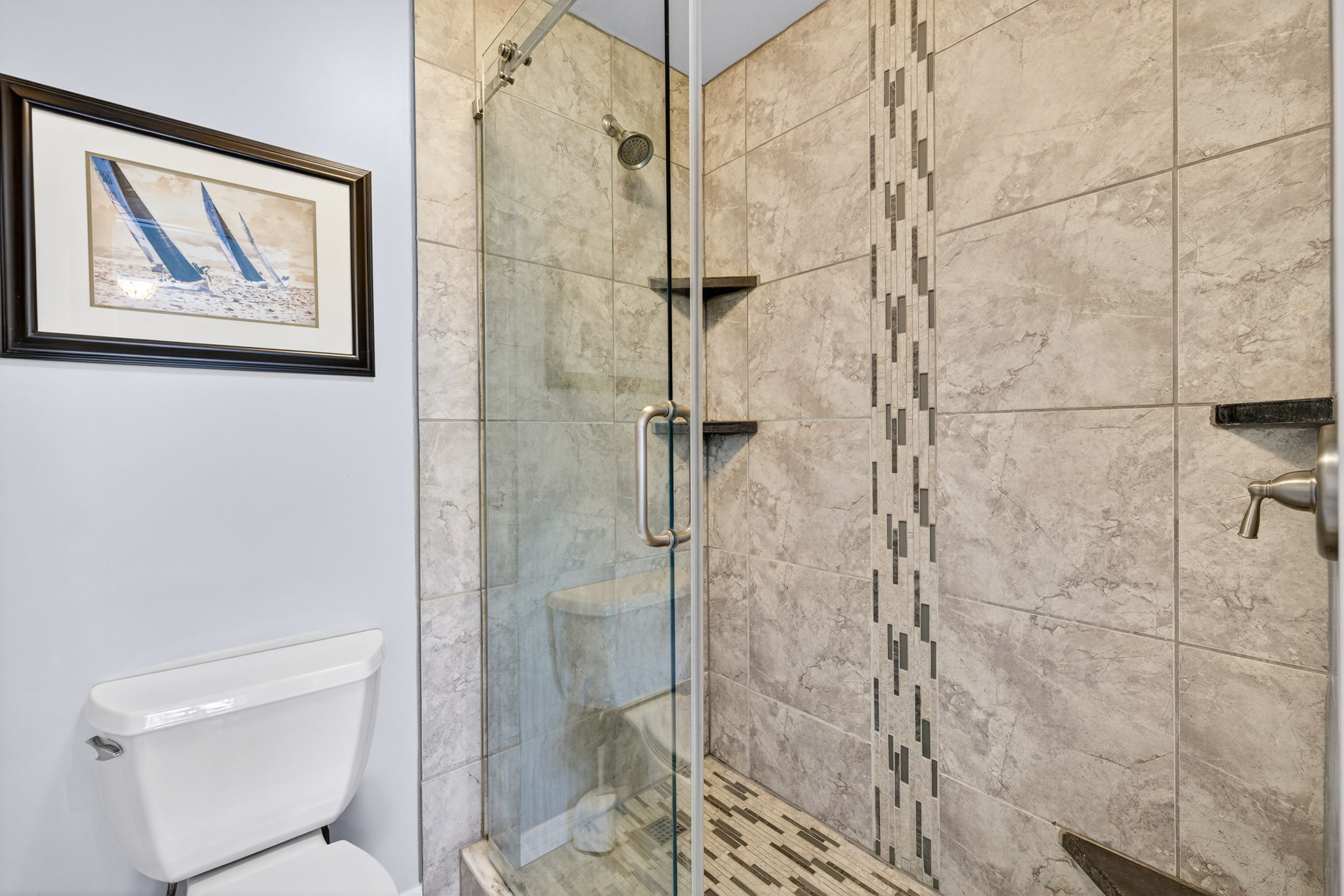 Primary bath has a spacious shower