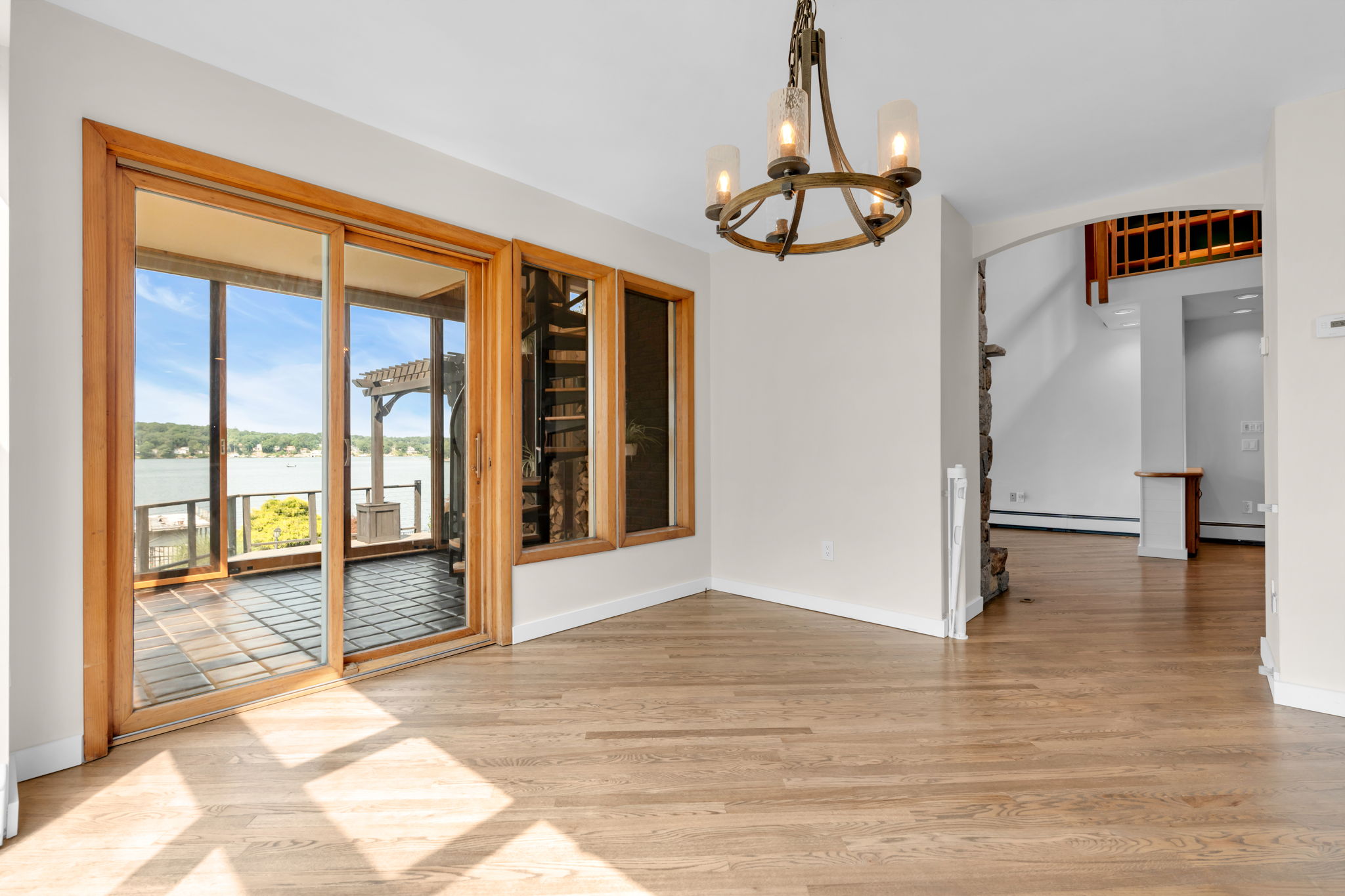 Dining rm off Great Rm with view to sunroom and lake