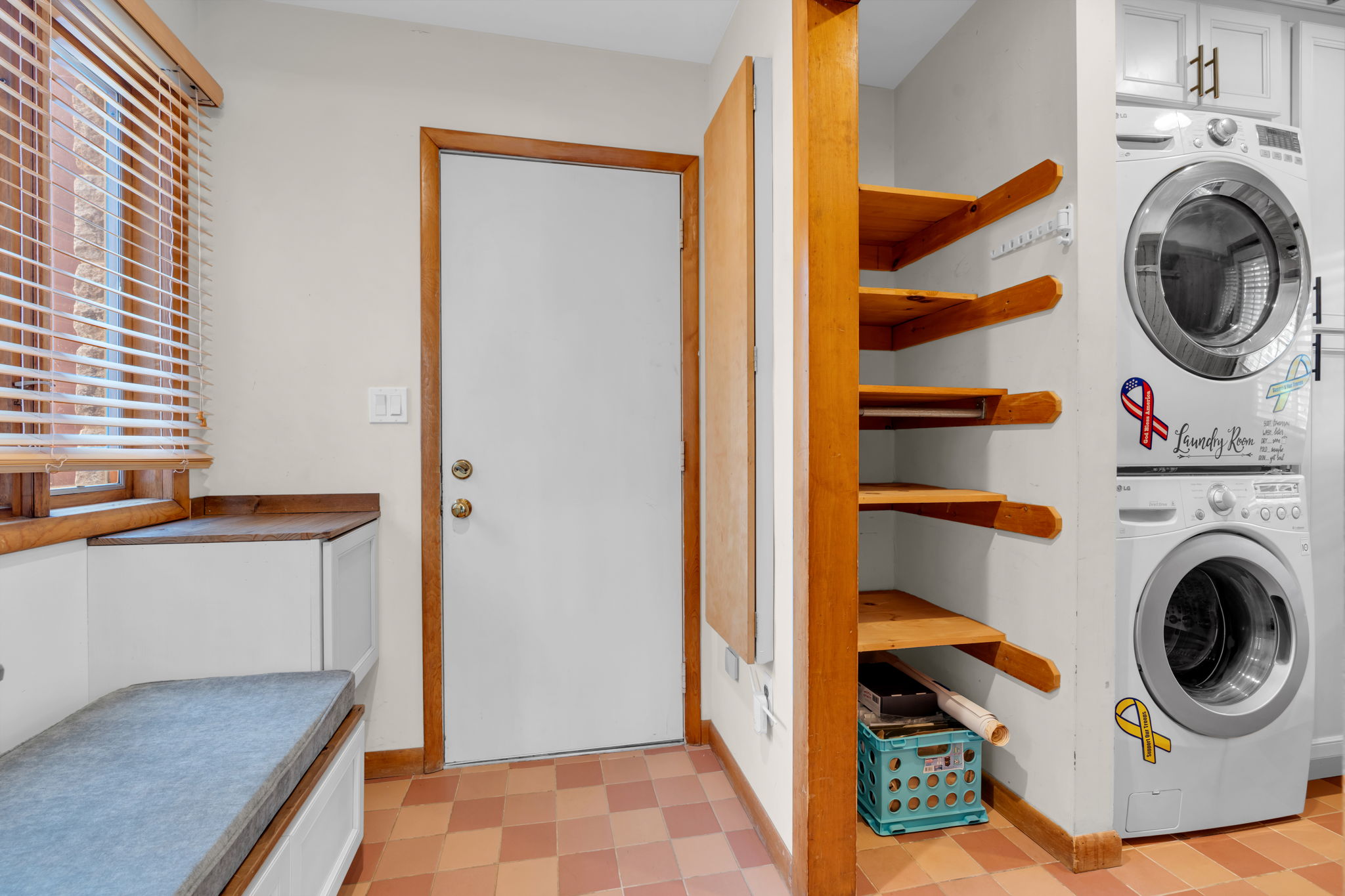 Mud room garage entry, Stackable washer/dryer with additional storage and side door walk-out to yard
