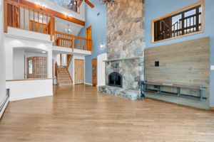 Great room floor to ceiling wood burning fireplace
