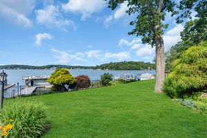 Open level lawn leads to lakefront