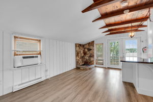 Beautiful lake views from the living/dining area. Open floor plan with continues new luxury vinyl flooring