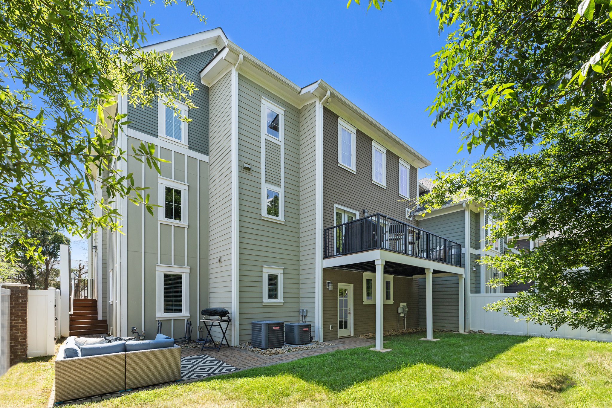 Fully fenced, plenty of grass and a brick paver patio.