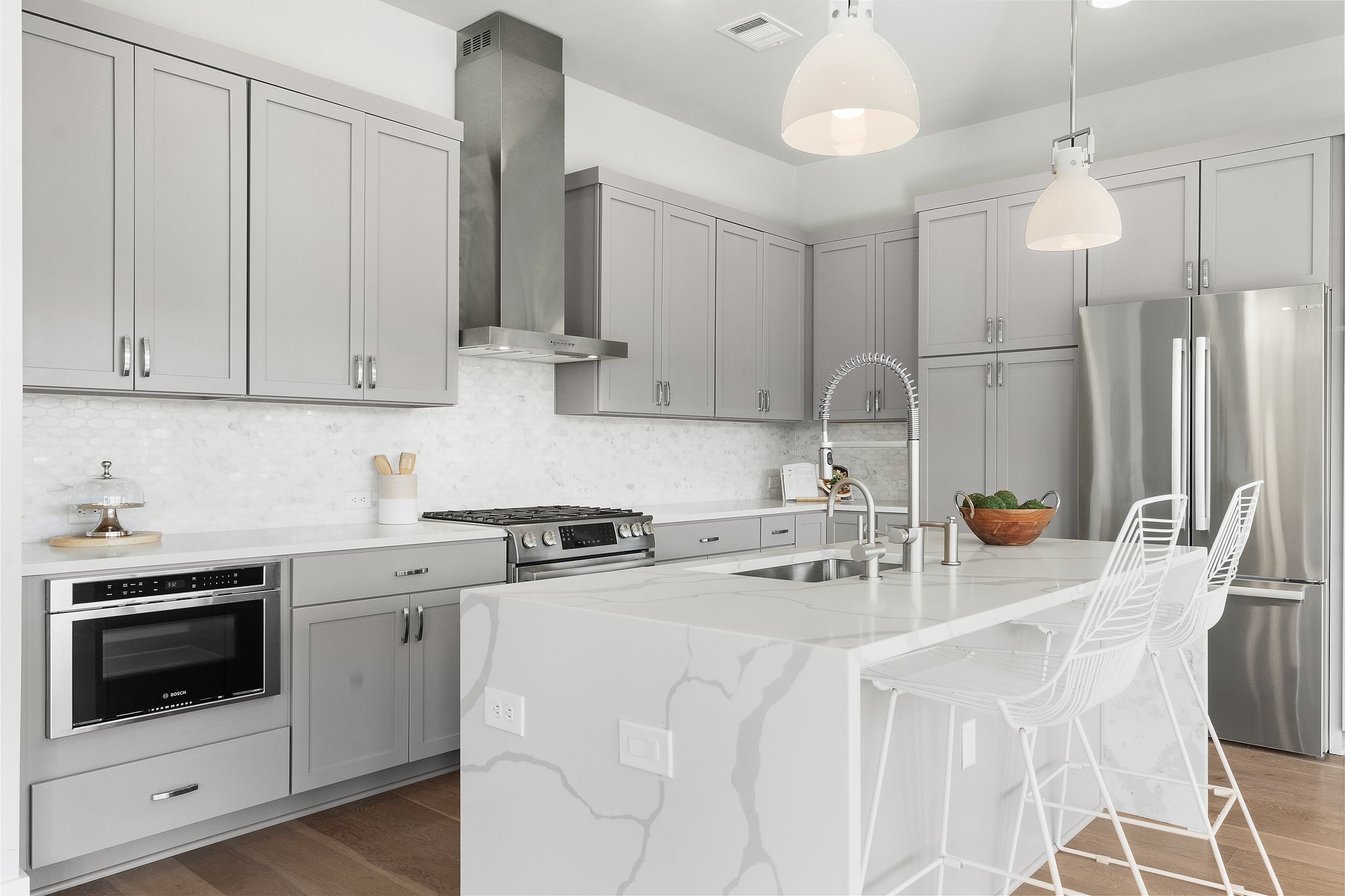 Marble mosaic backsplash adds refined Beauty