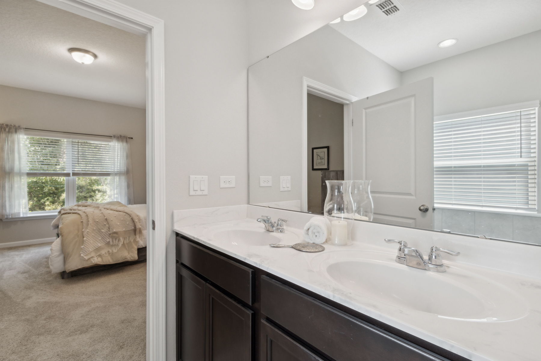 The same coffee cabinetry in the kitchen is carried through in the bathrooms...