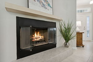 A REAL wood-burning fireplace provides a cozy ambiance