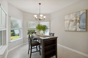 ... and adjacent to the kitchen is a sunny cafe dining area ...