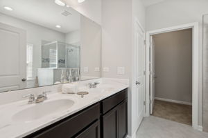 ...plus a classy master bath, with dual vanities...