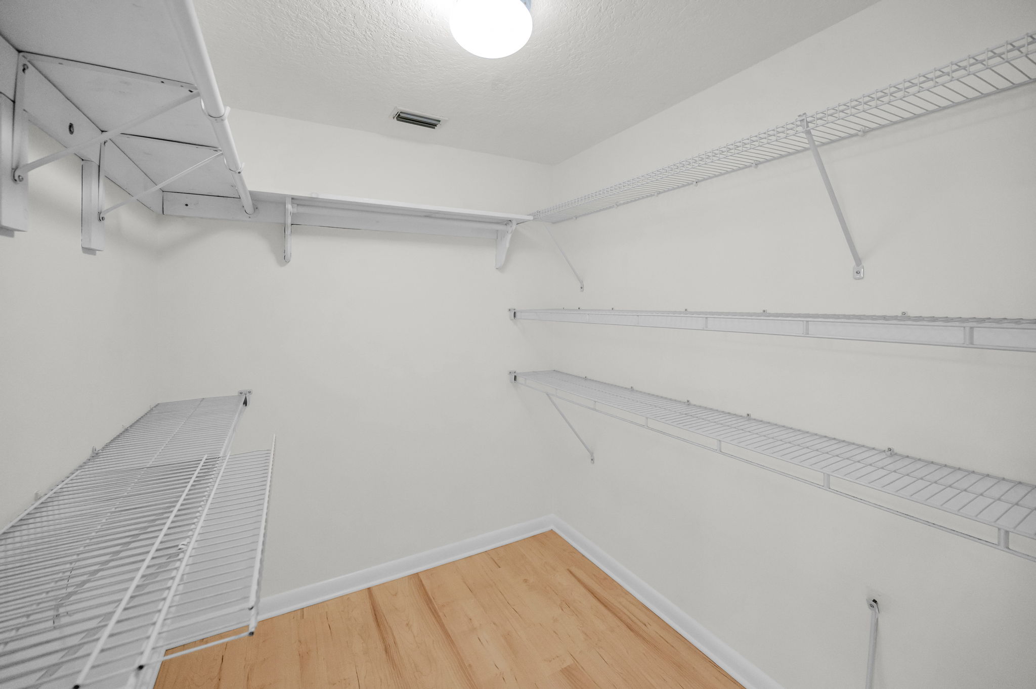 Primary Bedroom Walk-in Closet1a