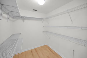 Primary Bedroom Walk-in Closet1a