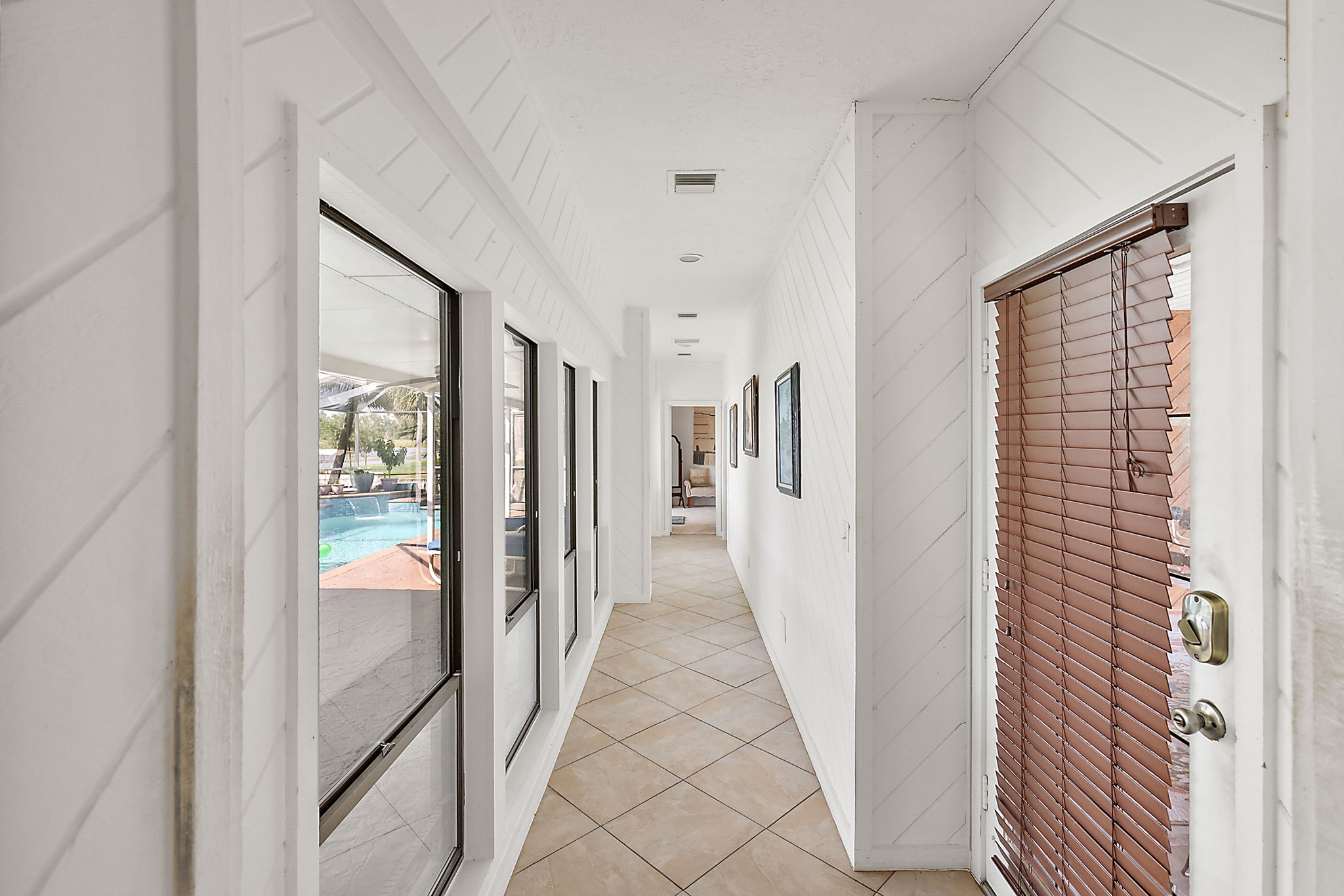 Hallway to Primary Bedroom / Entrance to home