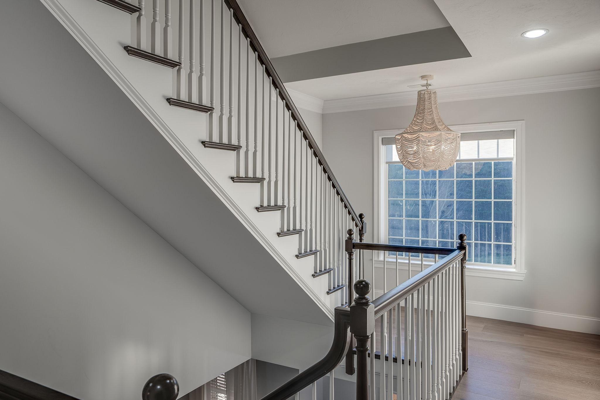 Designer Chandelier lights the landing to the third story