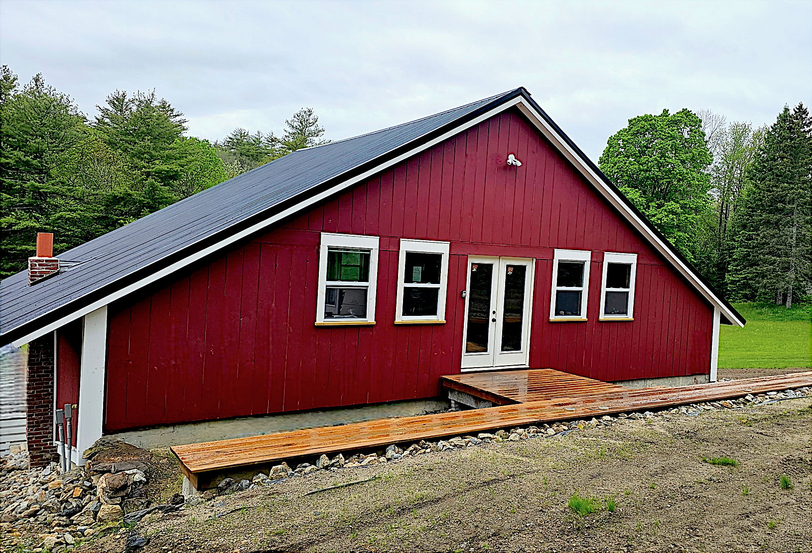 2nd story of barn offers direct walkout to yard for easy access and loading/unloading.