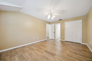 Comfortable primary bedroom with natural light and ensuite