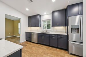 Updated cabinetry, quarts counters and new appliances