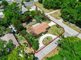 Corner lot with fully fenced backyard and mature shade trees