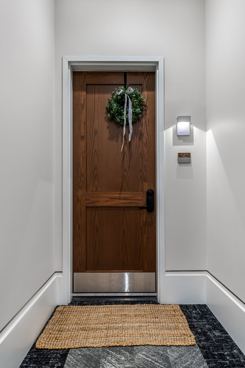 Striking wood entry door. Come inside to discover this meticulously curated home with designer finishes throughout.