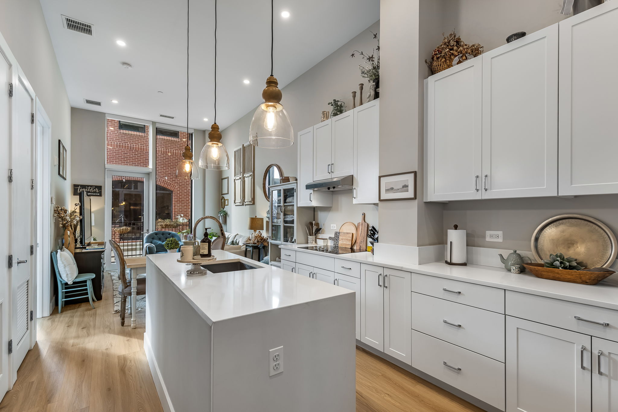 Enjoy first-floor exclusivity with soaring 12-foot ceilings that enhance natural light and open living spaces—perfect for entertaining.