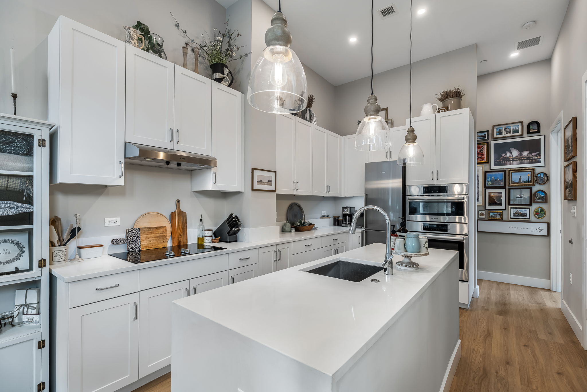 Large center island with Caesarstone quartz countertops.