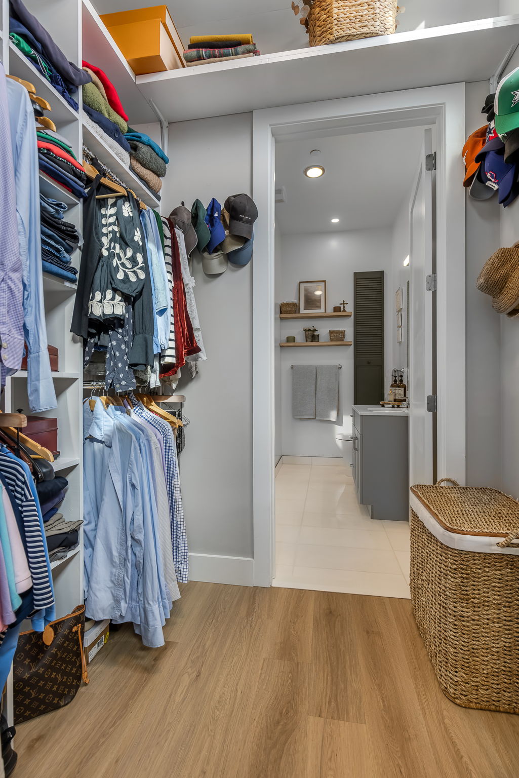 This intelligently designed walk-in closet maximizes storage with custom shelving and thoughtful organization, perfect for keeping your wardrobe organized and accessible.