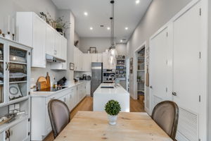 Recessed lighting and updated designer glass pendant lights.