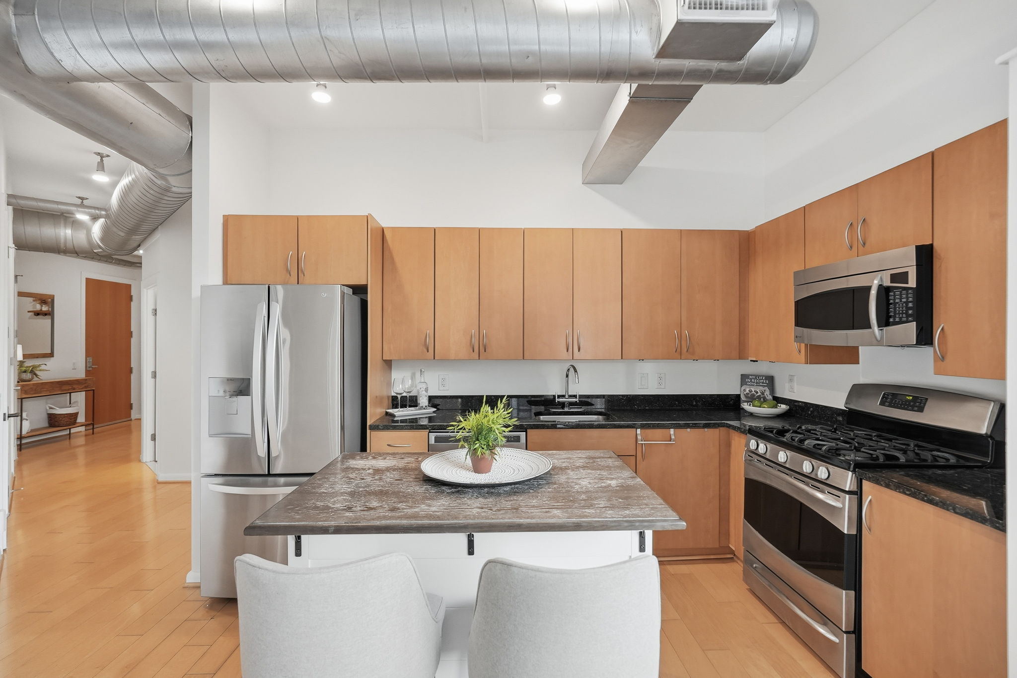 Kitchen w/ Stainless Steel Appliances and Ample Cabinetry